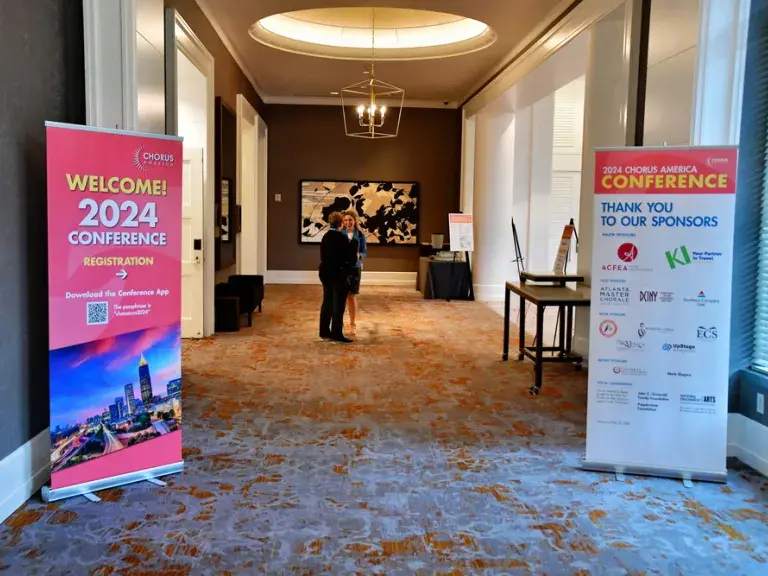 signs welcoming attendees to the 2024 Chorus America conference