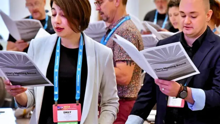 conference attendees participating in singing exercise